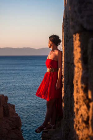 portrait of a girl on the background of the sea coastの写真素材