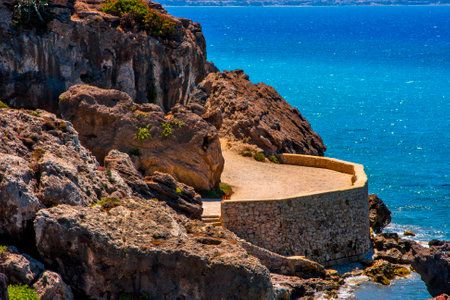 Rocky coast with a stone terrace on the background of the seaの写真素材