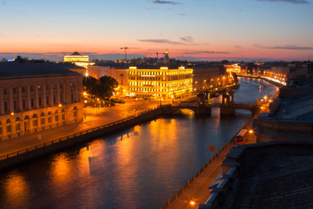 Night, promenade, houses and bridge under a beautiful skyの写真素材