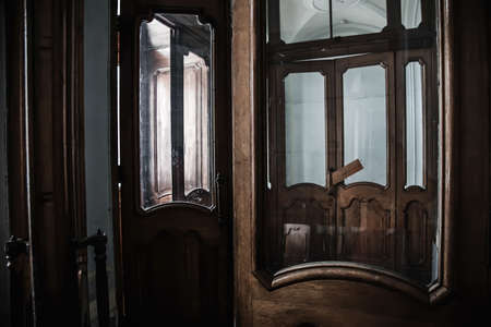 Antique wooden doors in an abandoned manor. Beautiful architecture.の写真素材