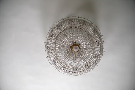 10.01.2021. Saint Petersburg. An old beautiful chandelier hangs in an abandoned manor house.