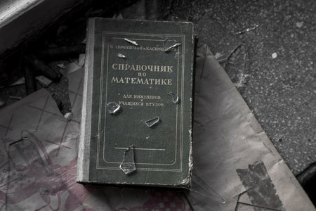 06/03/2021, Moscow, Russian Federation. An old book lies on the windowsill in an abandoned house.