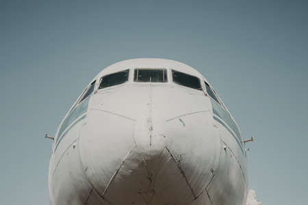 The nose of the plane against the blue sky. Old aircraft cabin. Sunny day.の写真素材