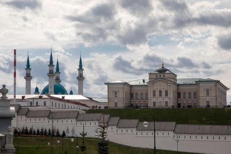 A beautiful Kremlin wall made of white bricks. High mosque in the fortress. Beautiful and ancient architecture.の写真素材