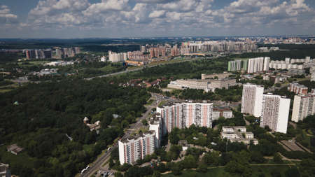 Beautiful city landscape from above. Tall houses and green parks. Sunny day. Beautiful city.の写真素材