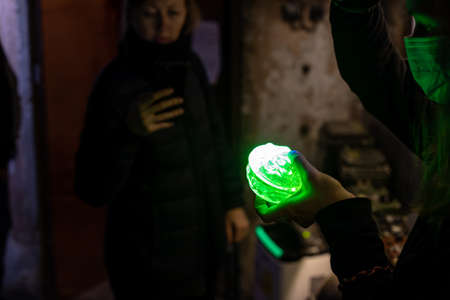 Radiation glow of green element. Light radiation in the ultraviolet. An old source of radiation.