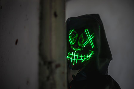 Scary halloween ghost with green neon light in the darkの写真素材