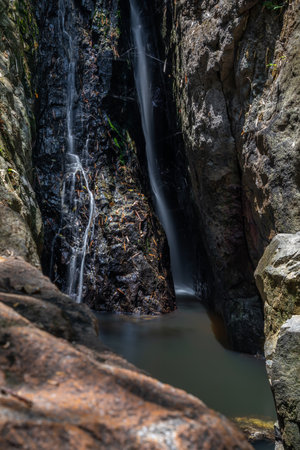 Waterfall in deep forest at Chiangmai province, Thailand.