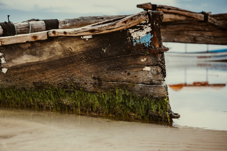 Old wooden boat on the beach in Thailand. Selective focus.の写真素材