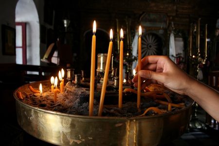Lighting a Candle in Churchの写真素材
