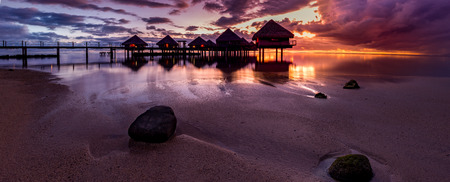 French Polynesia bungalows during sunsetの写真素材