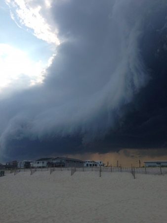 Crazy clouds coming over the beach の素材