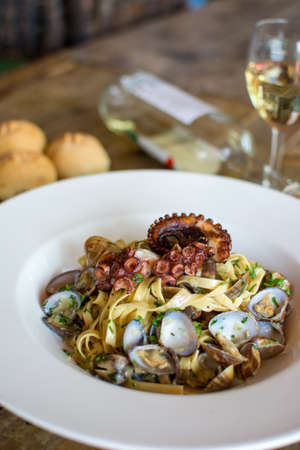 Pasta with seafood. marinara paste. Seafood. Italian style. Prawns and clams. octopus