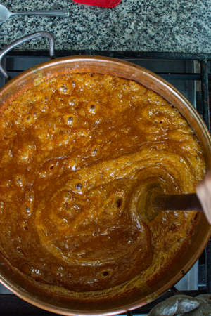 Caramel covered macadamia cake. toffee. Cake shop. Making macadamia cake. Kneading.の写真素材