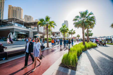 Jumeirah Beach Walk, Dubai, UAE.  2016.  A couple enjoy a stroll in Jumeriah Beach Walk in Dubai.のeditorial素材