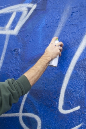 Hand Holding a Spray Paint Canの写真素材