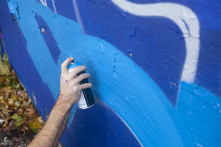 Hand Holding a Spray Paint Canの写真素材