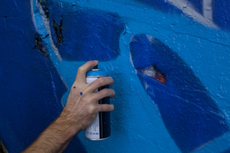 Hand Holding a Spray Paint Canの写真素材