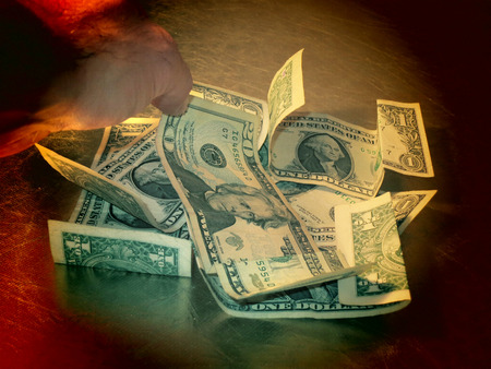 A filtered view of a pile of United States dollar bills の写真素材