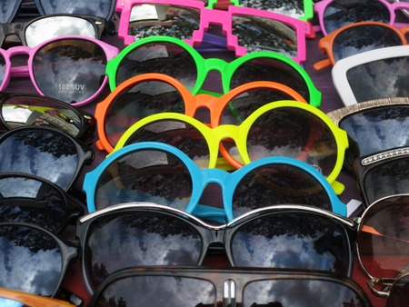 A display of colorful sunglassesの写真素材