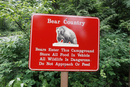 A beware of bears sign in Glacier National Park, Montana の写真素材
