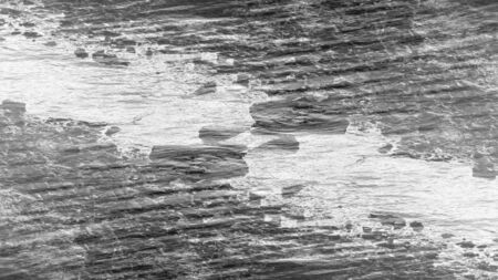 An abstract black and white grunge background image.