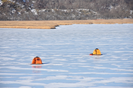iced river fishing