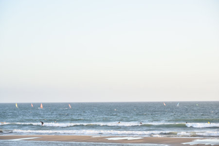 Windsurfers on the beach of Baltic Sea, Poland.の写真素材