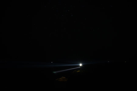 A view of the stars in the night sky from the mountain.の写真素材