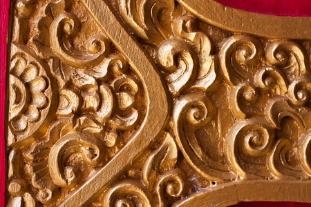 wood sarve on the door in thai templeの写真素材