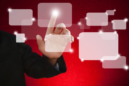 hand of business man touch on red touchscreenの写真素材