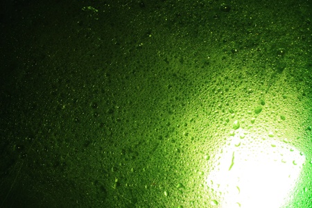 water drop on green glassの写真素材