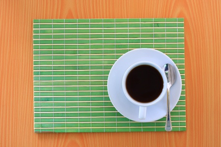 white coffee on green bamboo matの写真素材