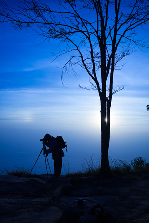 Silhouette of a photographer manの写真素材