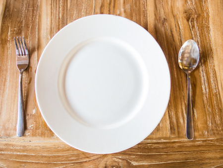 Empty plate with spoonの写真素材