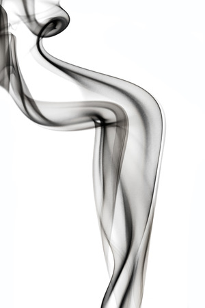 Floats black smoke on white background の写真素材