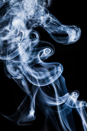 Floats white smoke on black background の写真素材