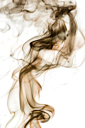 Floats brown smoke on white background の写真素材