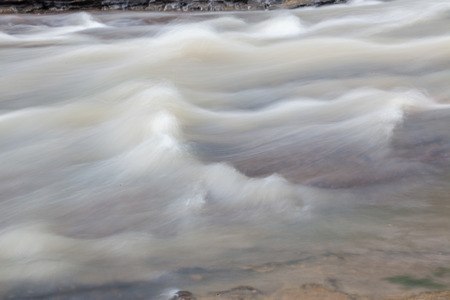 The surface of the water flowing in the plane.