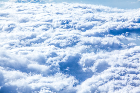 Photos of clouds from airplane cabins.