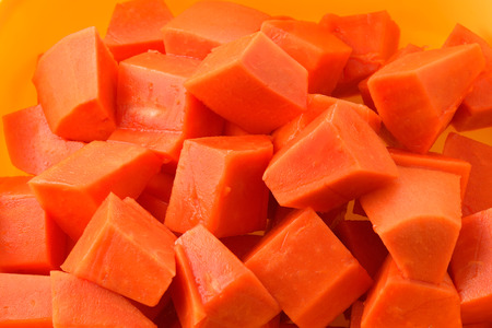 papaya and slice isolated on white backgroundの写真素材