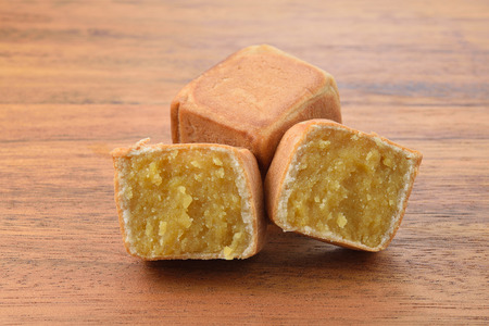 square chinese cake on wood