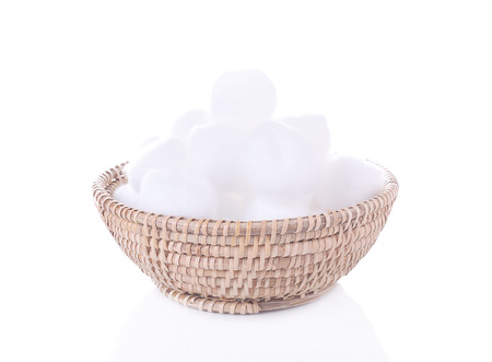 Cotton swabs in basket isolated on white backgroundの写真素材
