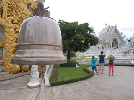 Door bell entrance of Wat Rong Khun  White temple の写真素材