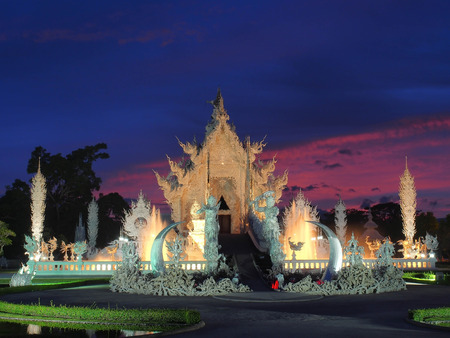 The White Temple (Wat Rong Khun) was under amazed sunset sky, Chiangrai, Thailandの写真素材