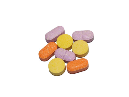 Tablets medicine in multiple colors, isolation on white