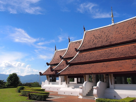 Northern-styled Thai art in public church under blue sky, Chiangrai, Thailandの写真素材