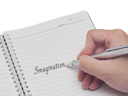 Notebook with writing hand isolation on whiteの写真素材
