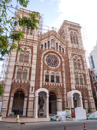Assumption church under renovation in Bangkok under cloudy skyの写真素材
