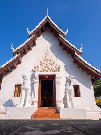 Main church of Wat Phra That Chae Haeng in Nan, Thailand under blue skyの写真素材